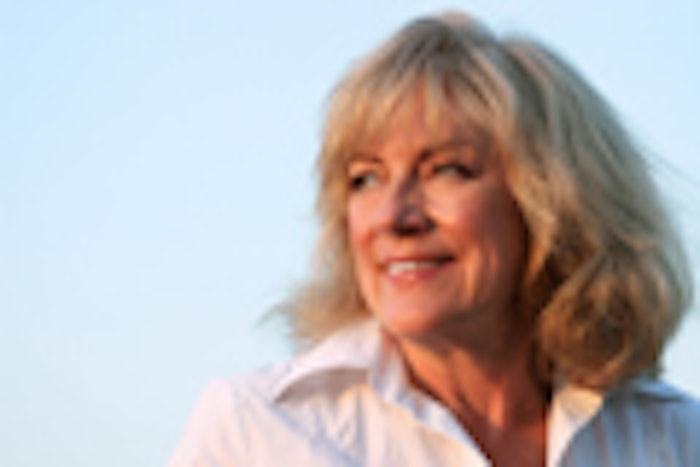A beautiful, mature woman looking into the late day sun, facing her future.