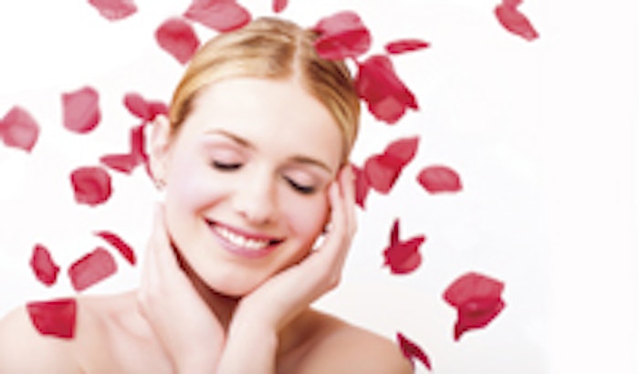 Beautiful girl surrounded by rose petals.