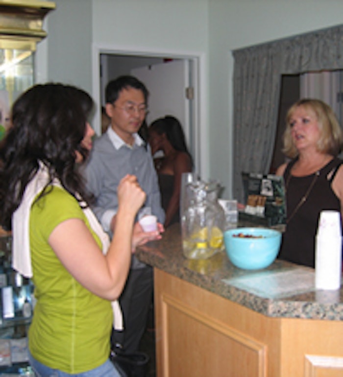 Cindy Arvayo, right, owner of Beautiful By Design, speaks with spa tour attendees.
