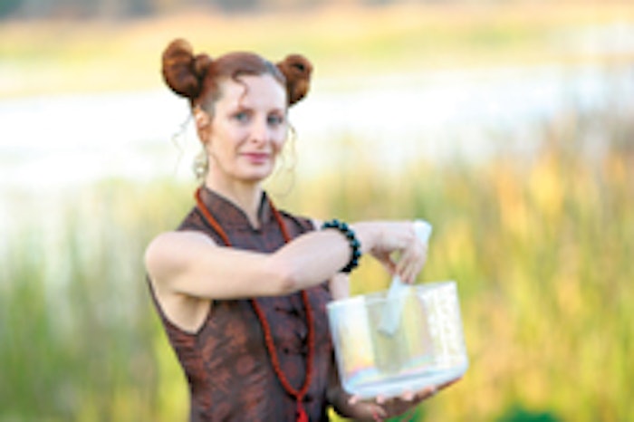 Playing a special “alchemy” singing crystal bowl made with platinum, musician, sound-healing spa consultant and qi gong practitioner Eluv encourages stress relief and calmness through sound and music.
