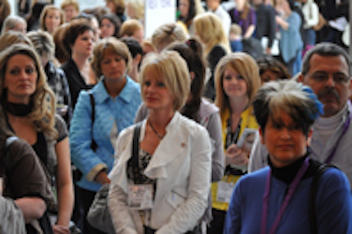 Attendees crowd patiently before the expo hall opens.