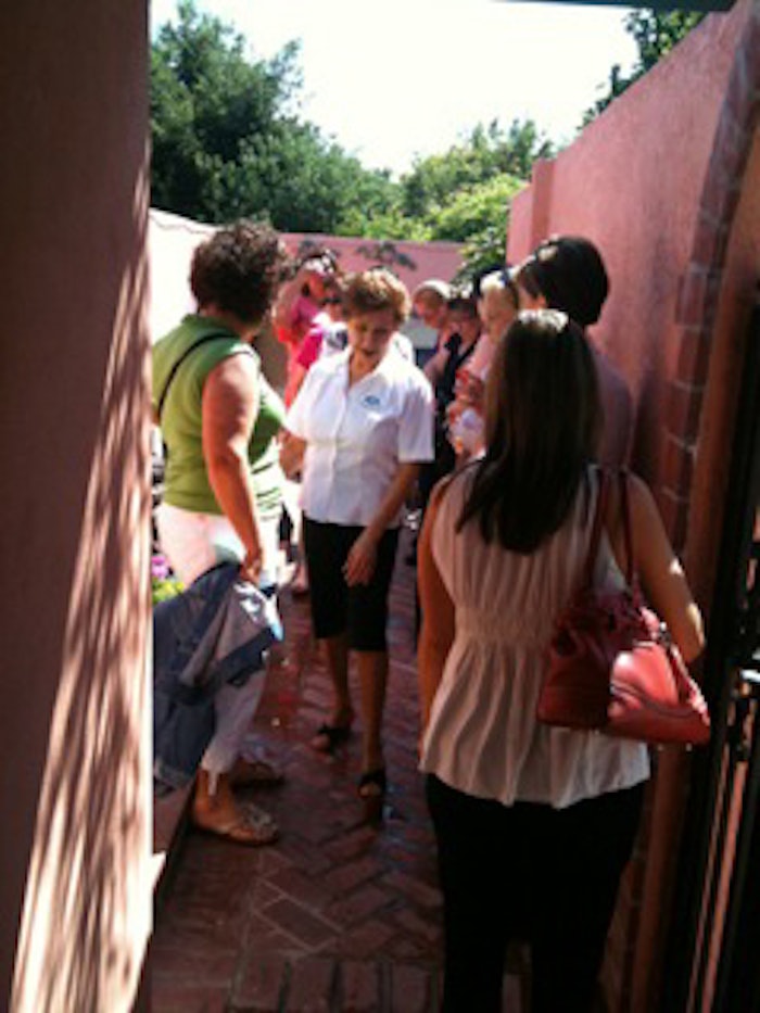 Gloria Maciel, owner of La Concha Spa, shows attendees the outdoor sauna during this Spa Tour.