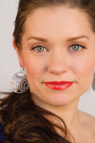 A neutral eye with a semiglossed tangerine lip exemplifies the vivid, uplifting mood of Spring 2012.