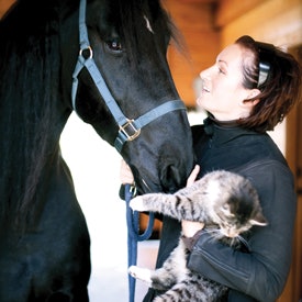 Noel Asmar with her horse and cat