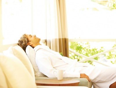 man relaxing in lounge of spa
