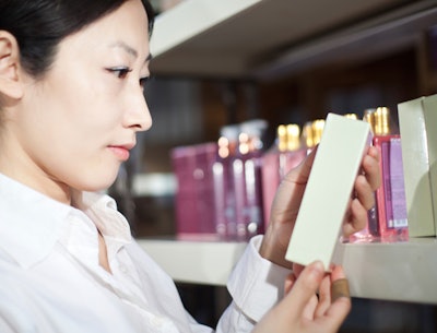 woman looking at beauty products