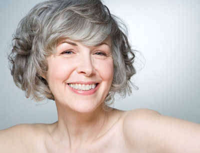 happy mature female with clear skin