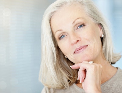 smiling woman over 50 with clear skin