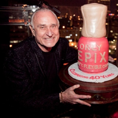 Jeff Pink poses with his ORLY EPIX cake