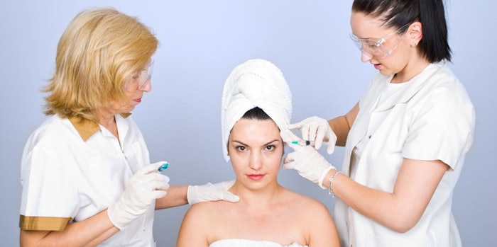 Woman getting botox inject to eyebrow
