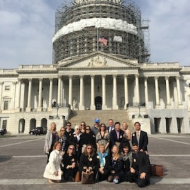 Symposium attendees gather outside the Capitol.