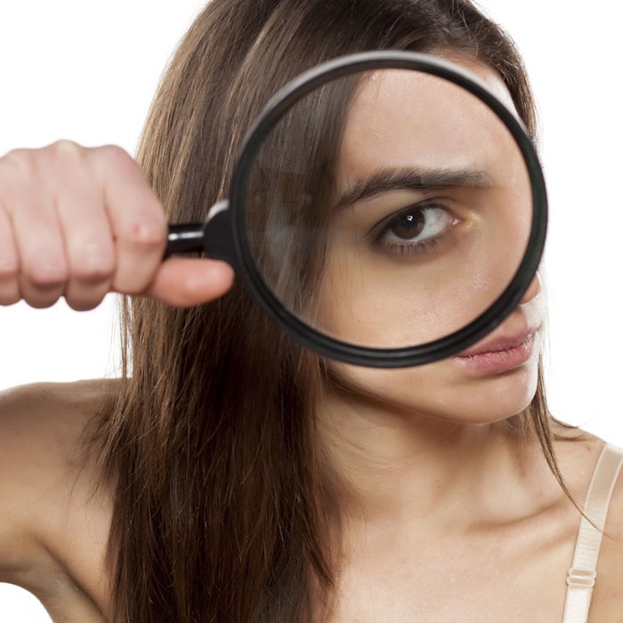 SkepticWomanMagnifyGlass850