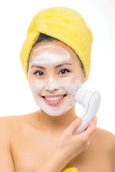Clients can manually exfoliate their skin at home with a scrub, abrasive pads or brushes. There are different facial scrubs that contain granules of certain nuts, jojoba beads, salts, sugar and other substances with a granular texture. When these topical home care products are used, they are often recommended twice a week. There are also manual buffing pads on the market that can be irritating to the skin, especially when over used. One of the most popular forms of home exfoliation is the use of mechanical cleansing brushes, which offer a safe, easy-to-use exfoliation method with a low risk of side effects. Mechanical exfoliation treatments most commonly used by an esthetician are microdermabrasion, dermaplaning, and high-pressure saline exfoliation, which will be discussed below.