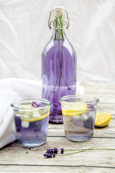 Homemade lavender lemonade, swing top bottle and glasses