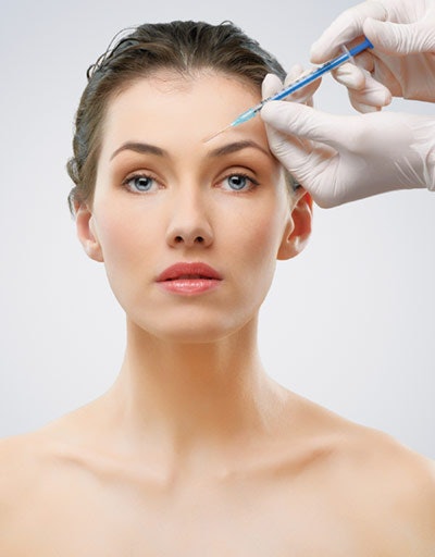 Someone receiving a botox injection