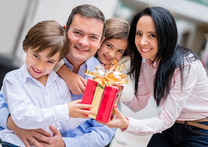 Family holding a gift