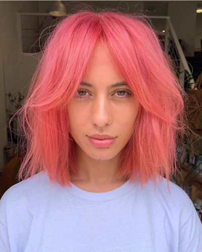 Client with short, pink hair and long fringe