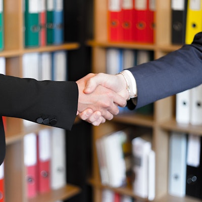 Midsection of people holding hands