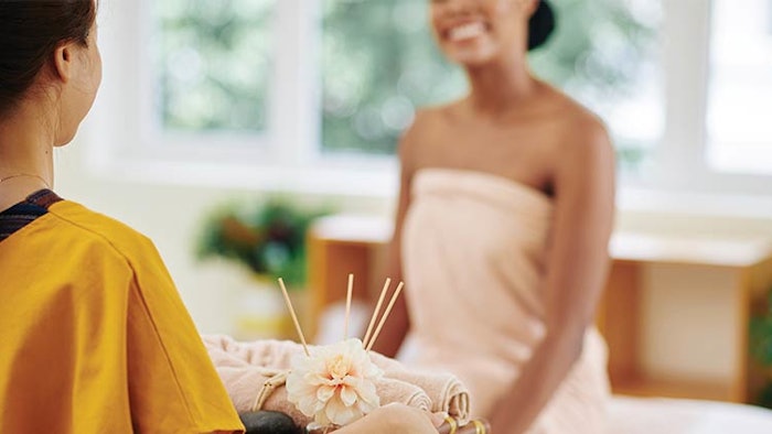 Woman checking in at spa