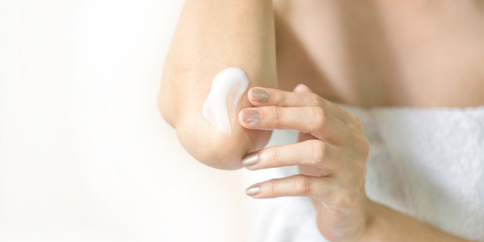WomaninWhiteTowelApplyingCreamtoElbow_850x425