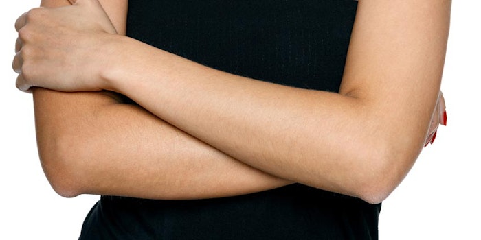 WomanArmsCrossedStomachRubbing_850x425