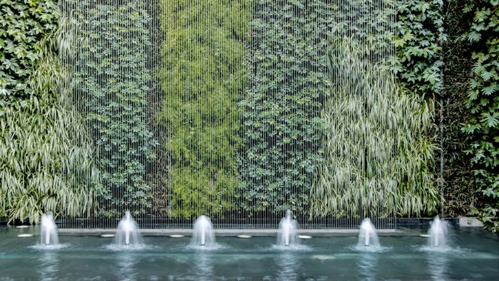 Living plant walls are a biophilic spa design concept that could help clients reduce stress.