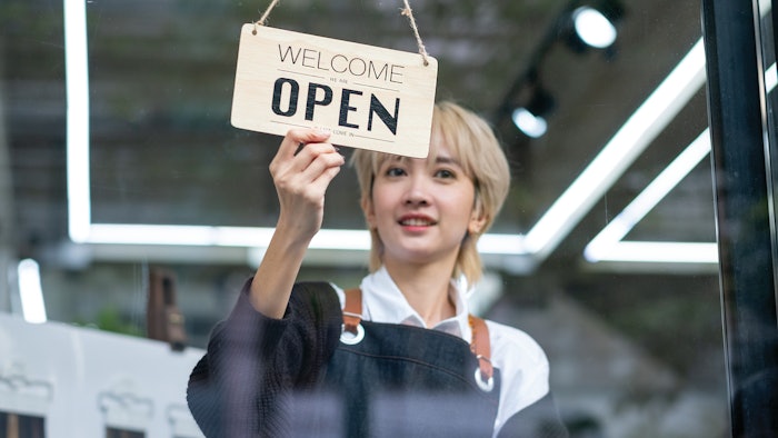 woman opening her business up