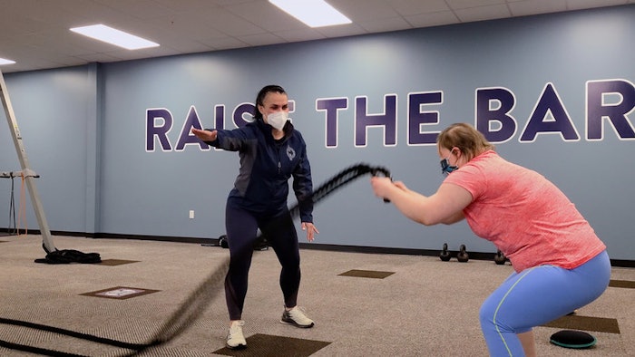 An athlete trains with a coach at the Inclusive Fitness facility in West Roxbury, MA.