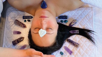 Woman getting gemstone facial
