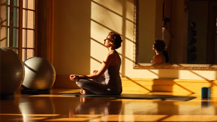 woman meditating at accor hotel