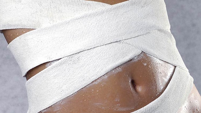 Woman wearing body slimming wrap
