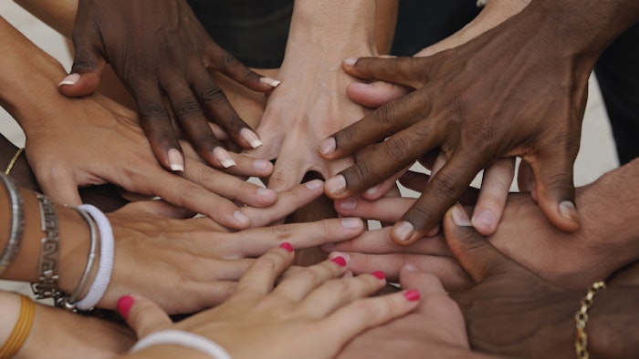 diverse hands placed together