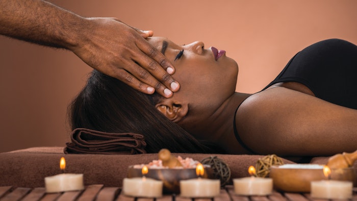 black woman receiving spa treatment
