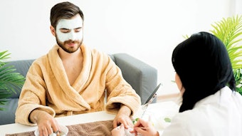 man receiving nail care