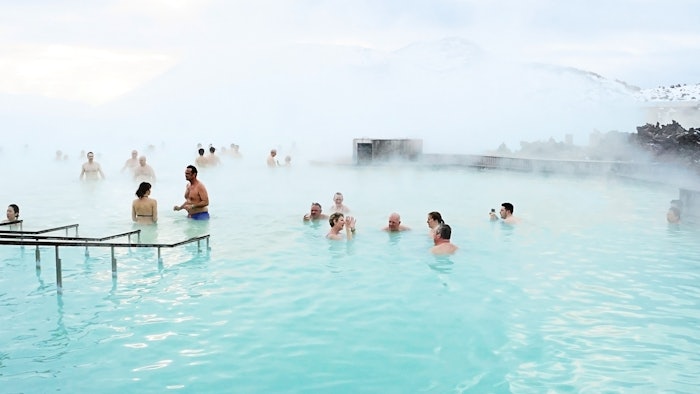Tourists enjoy taking a bath at Blue Lagoon thermal springs in Iceland