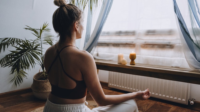 woman meditating at home