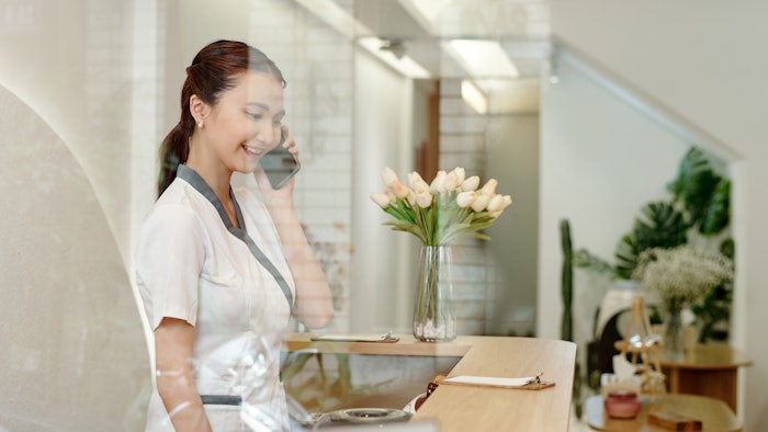 Spa professional answering the phone