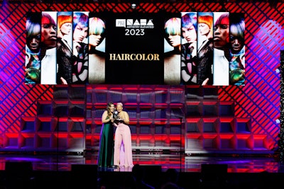 The NAHA Award for Haircolor is presented to Luis Gonzalez.