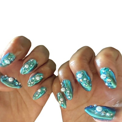 Manicurist Yoko Sakakura created Halle Bailey's nail look for The Little Mermaid Premiere at the Dolby Theater in Hollywood.
