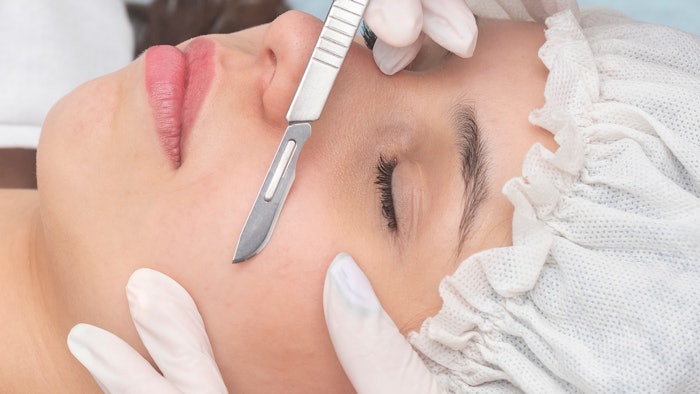 Woman getting dermaplaned