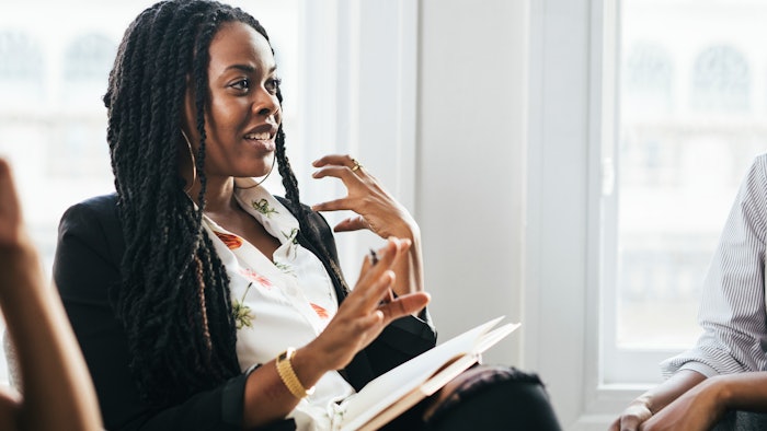 Black business woman in discussion