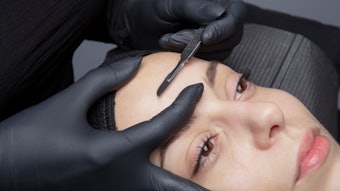Woman gettig dermaplaning treatment
