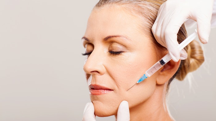 Older Woman receiving facial injection
