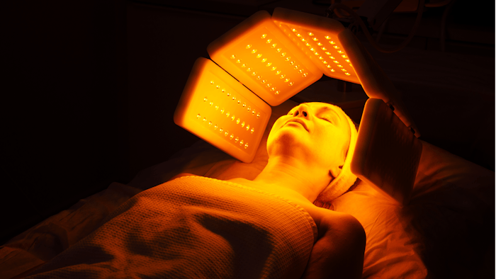 woman receveing facial rejuvenation light therapy reatment