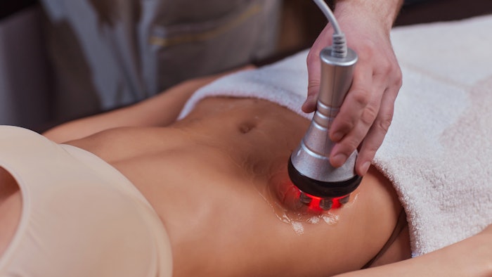 Woman getting body contouring treatment