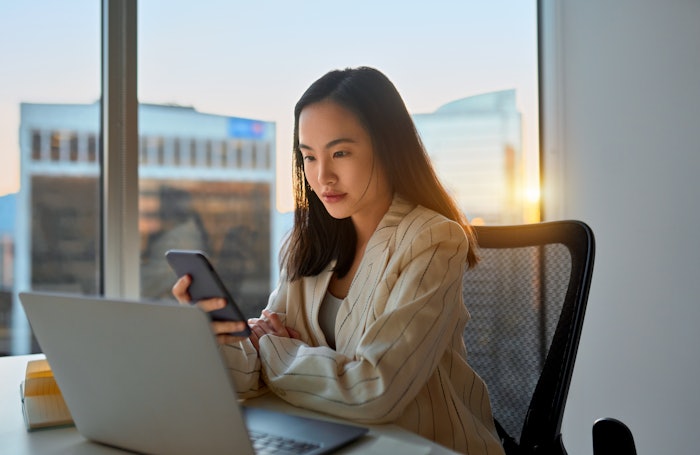 Woman reading laptop