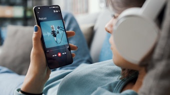 Woman Listening to Podcast