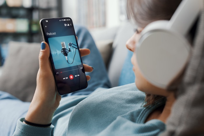 Woman Listening to Podcast