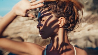 Woman Shielding Eyes from Sun