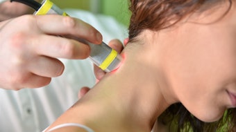 Laser therapy. Physical therapist treating patient neck